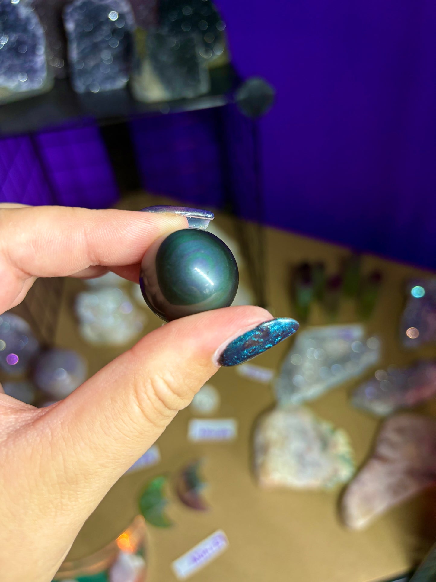 Small rainbow obsidian sphere