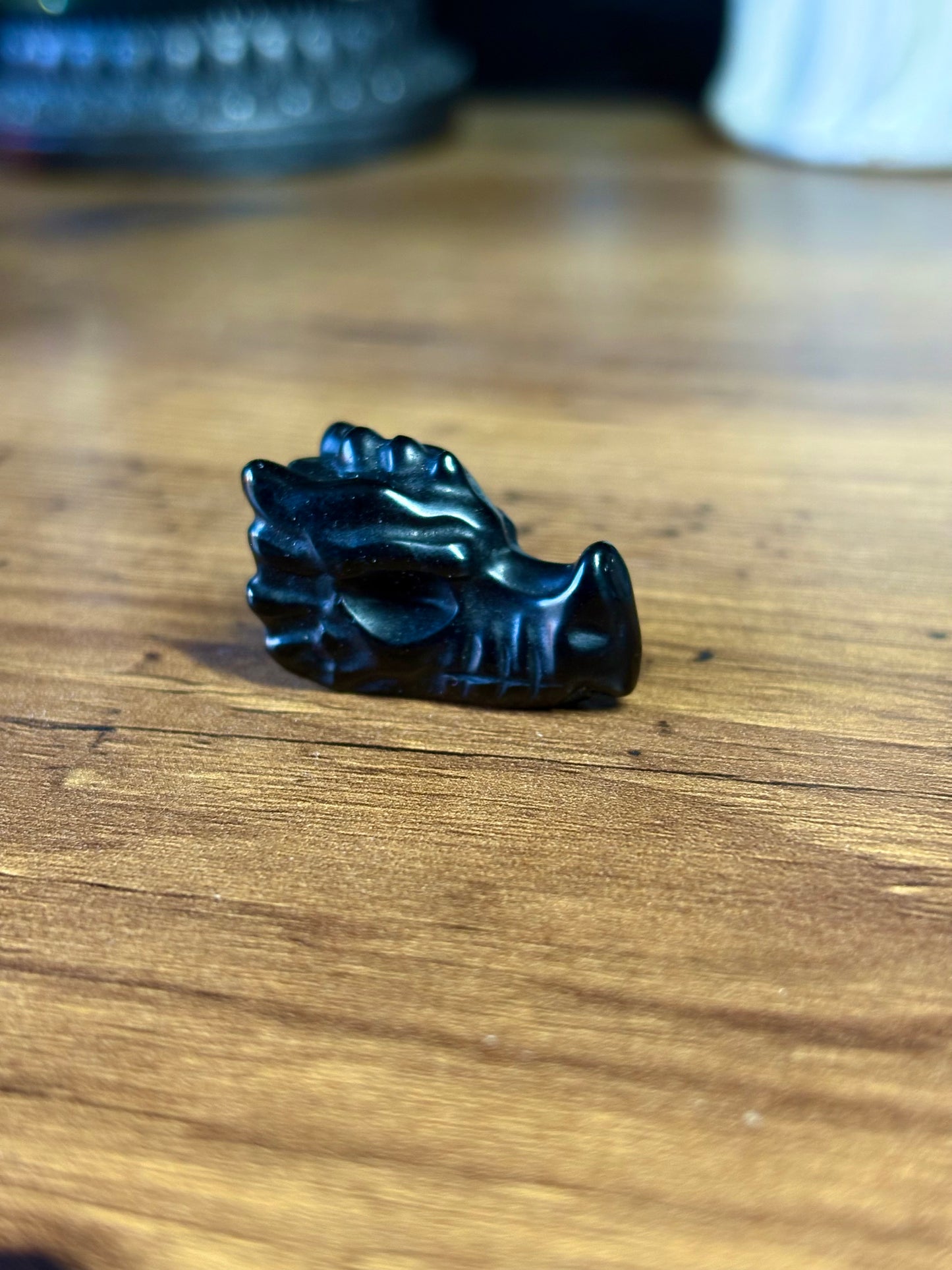 Black obsidian dragon skull carving
