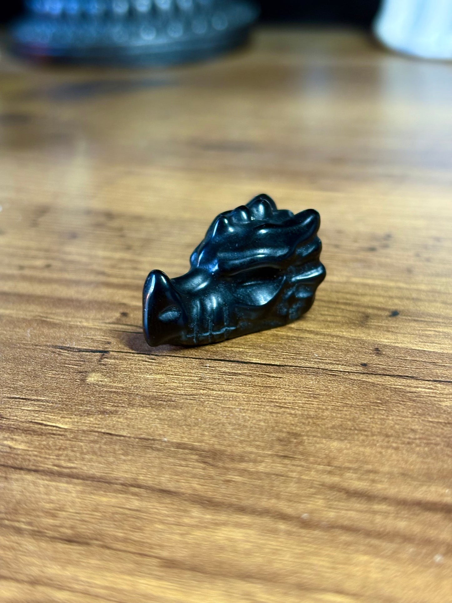 Black obsidian dragon skull carving
