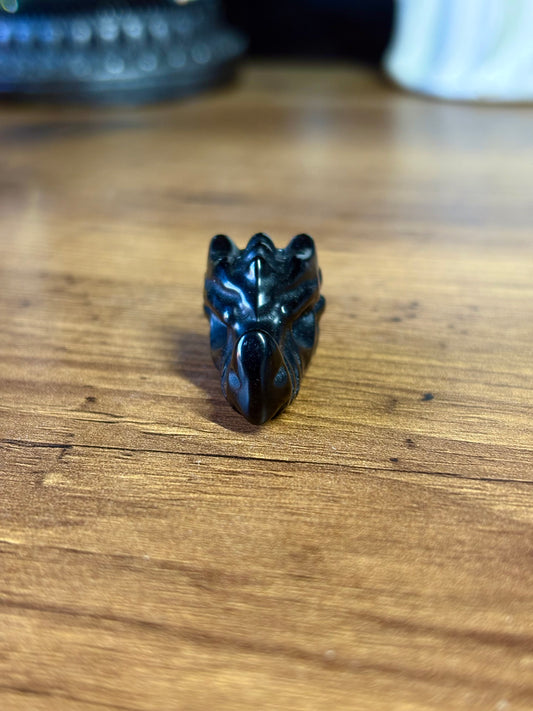 Black obsidian dragon skull carving